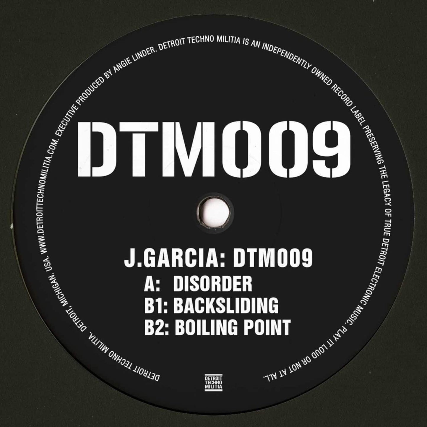 Decks J. GARCIA DTM009 vinyl record with black and white label, close-up of the back cover showing the record's design.