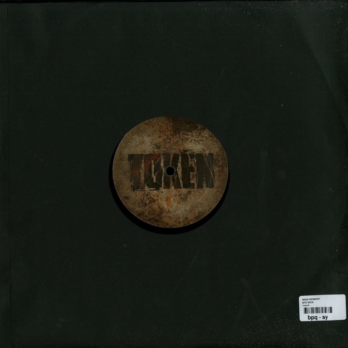 Second Hand vinyl record of INIGO KENNEDY – BITE BACK, showing the back cover with track listings and artwork.
