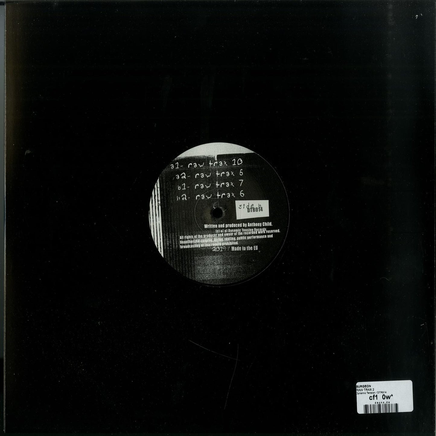 Second Hand SURGEON RAW TRAX 2 vinyl record with black label and textured surface, viewed from the back.