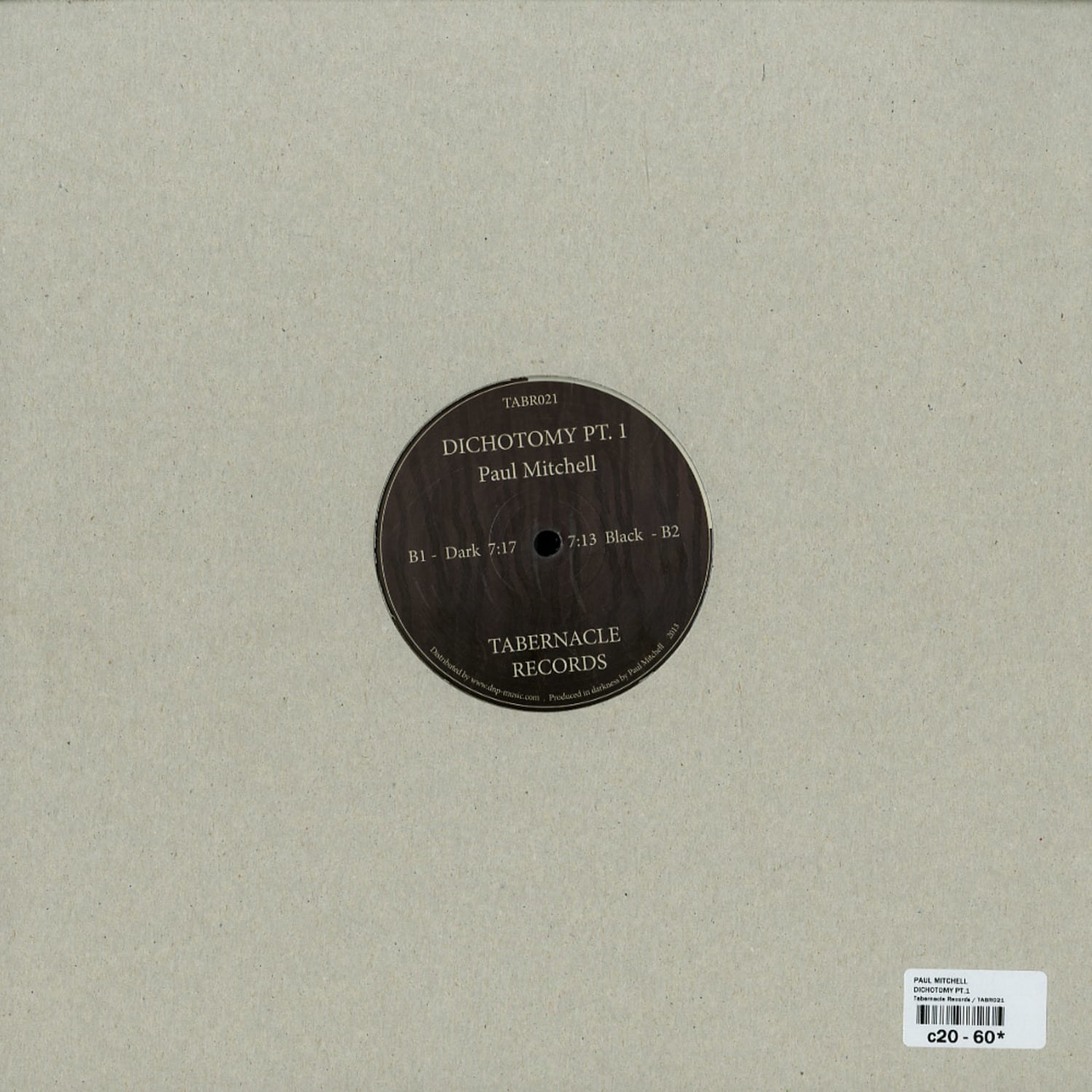 Second hand Paul Mitchell Dichotomy Pt.1 vinyl record with a black and white label, shown from the back side.