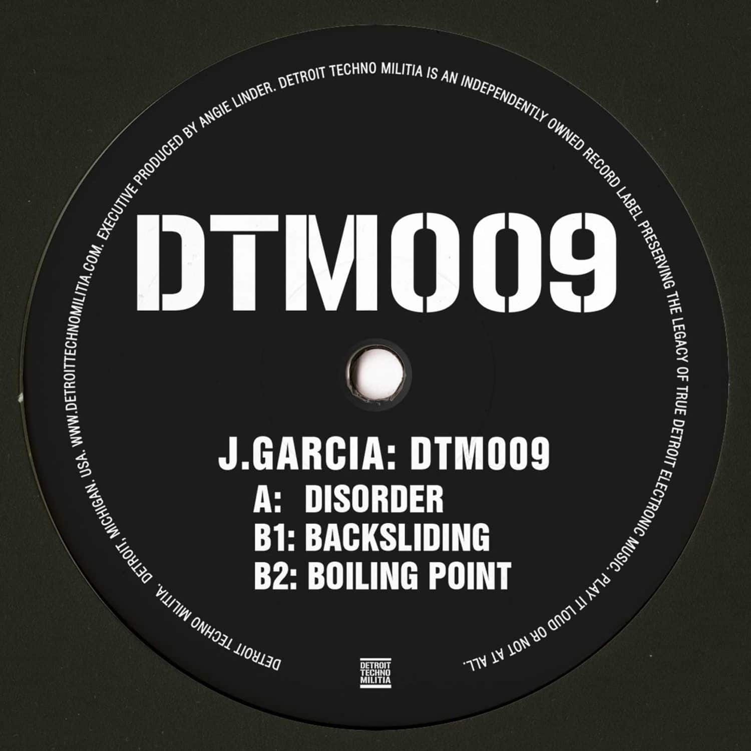 Decks J. GARCIA DTM009 vinyl record with black and white label, close-up of the back cover showing the record's design.