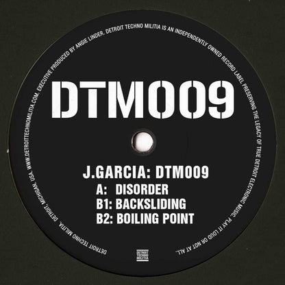 Decks J. GARCIA DTM009 vinyl record with black and white label, close-up of the back cover showing the record's design.