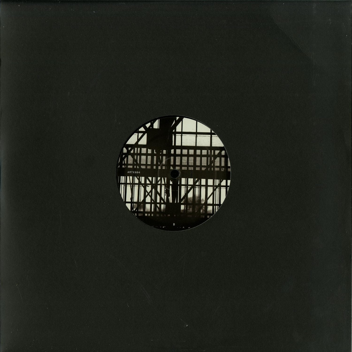 Second Hand AMOTIK 004 vinyl record with a black label and vintage design, showing the back cover artwork.