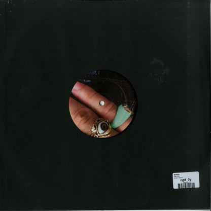 Second Hand MORAH #010 vinyl record placed on a turntable showing the back cover with artwork and tracklist.