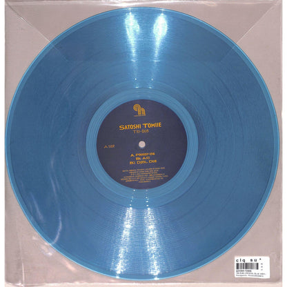 Back of Satoshi Tomiie Tri-Dub vinyl record by Syncrophone, featuring the album artwork on a black background.