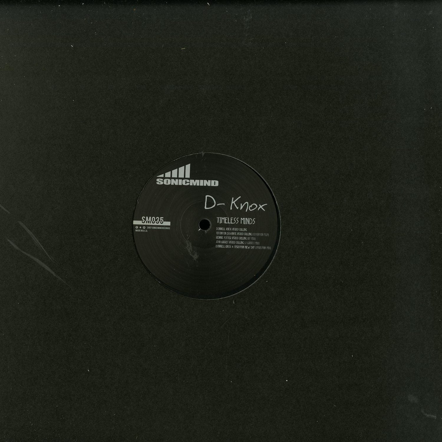 Vintage vinyl record of Timeless Minds by D-KNOX, TITONTON FLIP, RENNIE FOSTER, JOSH GARRET, and SPIRITMAN with colorful album cover art.
