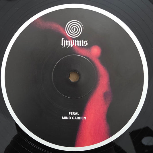 Triple Vision FERAL – MIND GARDEN vinyl record with colorful album art featuring abstract garden design and bold typography.