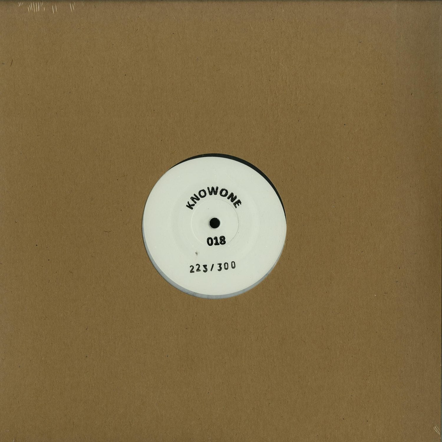 Decks vinyl record UNKNOWN ARTIST – KNOWONE 018 with black label and cover art featuring abstract design on front.