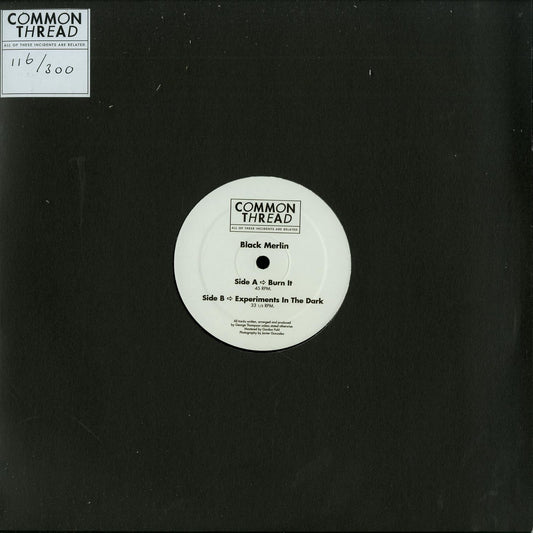 Black Merlin vinyl record titled "Burn It / Experiments in the Dark" with dark cover art and minimal text, second hand condition.
