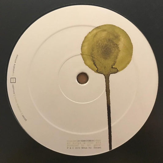 GAISER Unstable Static vinyl record with abstract cover art displayed on a wooden surface.