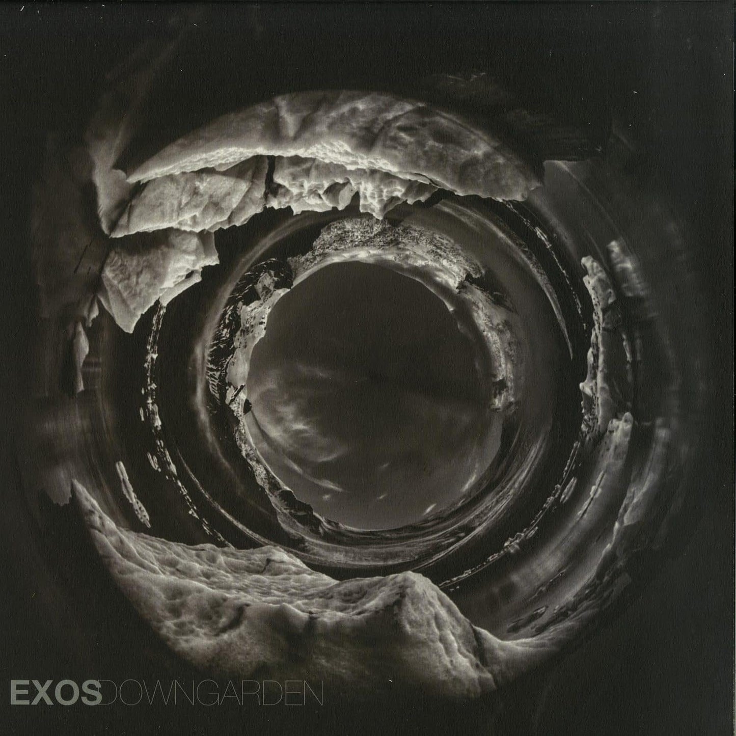 Second Hand EXOS DOWNGARDEN vinyl record with colorful album cover art featuring abstract designs and vibrant imagery.