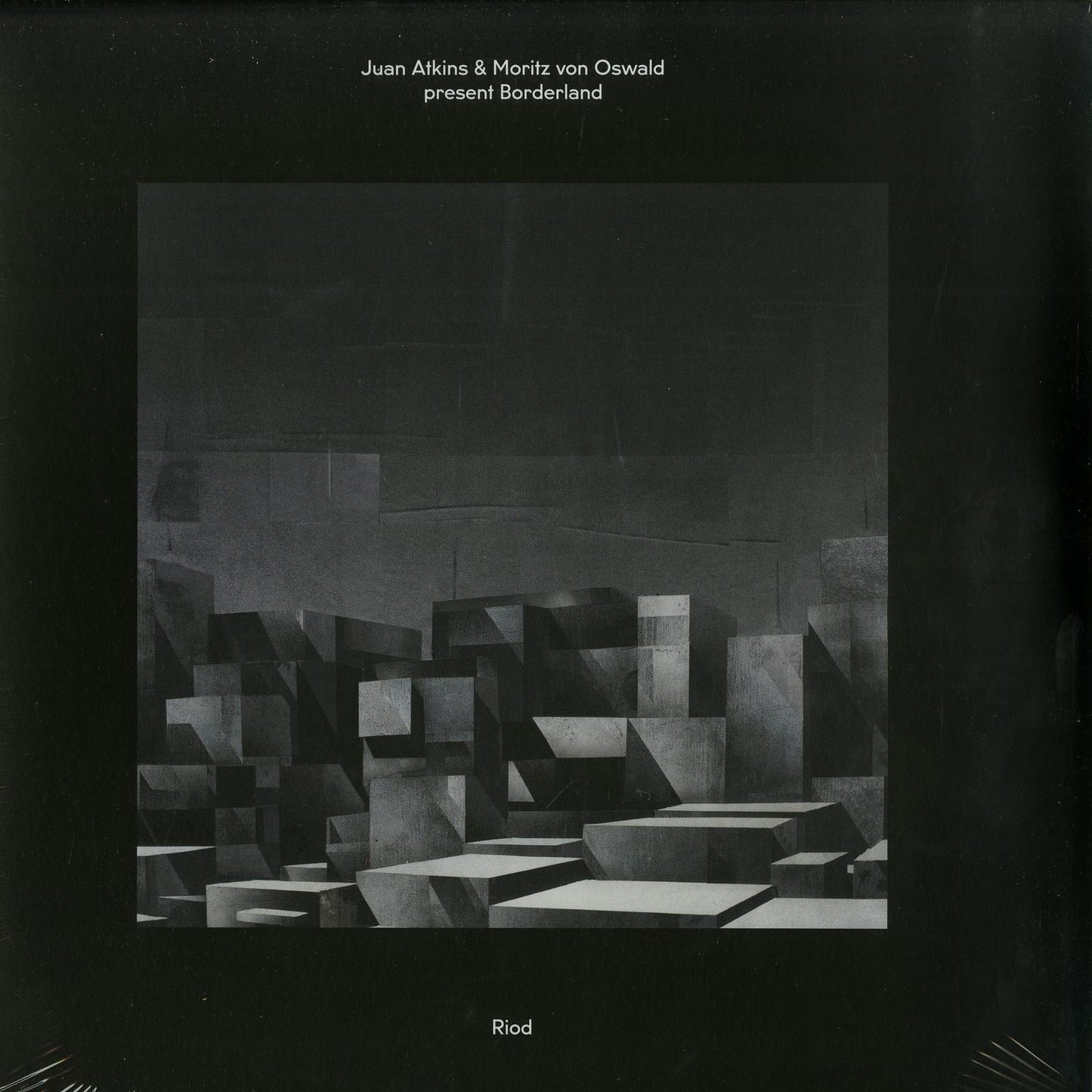 Second hand vinyl record titled "Borderland" by Juan Atkins and Moritz von Oswald, with colorful abstract cover art.