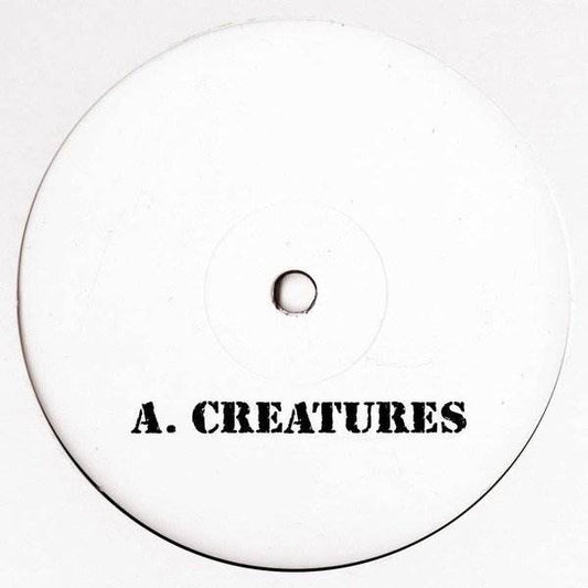 Vinyl record of "Creatures / Habit" by UNKNOWN ARTIST featuring colorful artwork on the front cover.