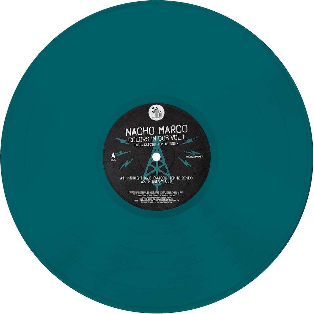 Vinyl record titled "Colors in Dub Vol. 1" by Nacho Marco and Satoshi Tomiie, displayed on a turntable with colorful cover art.