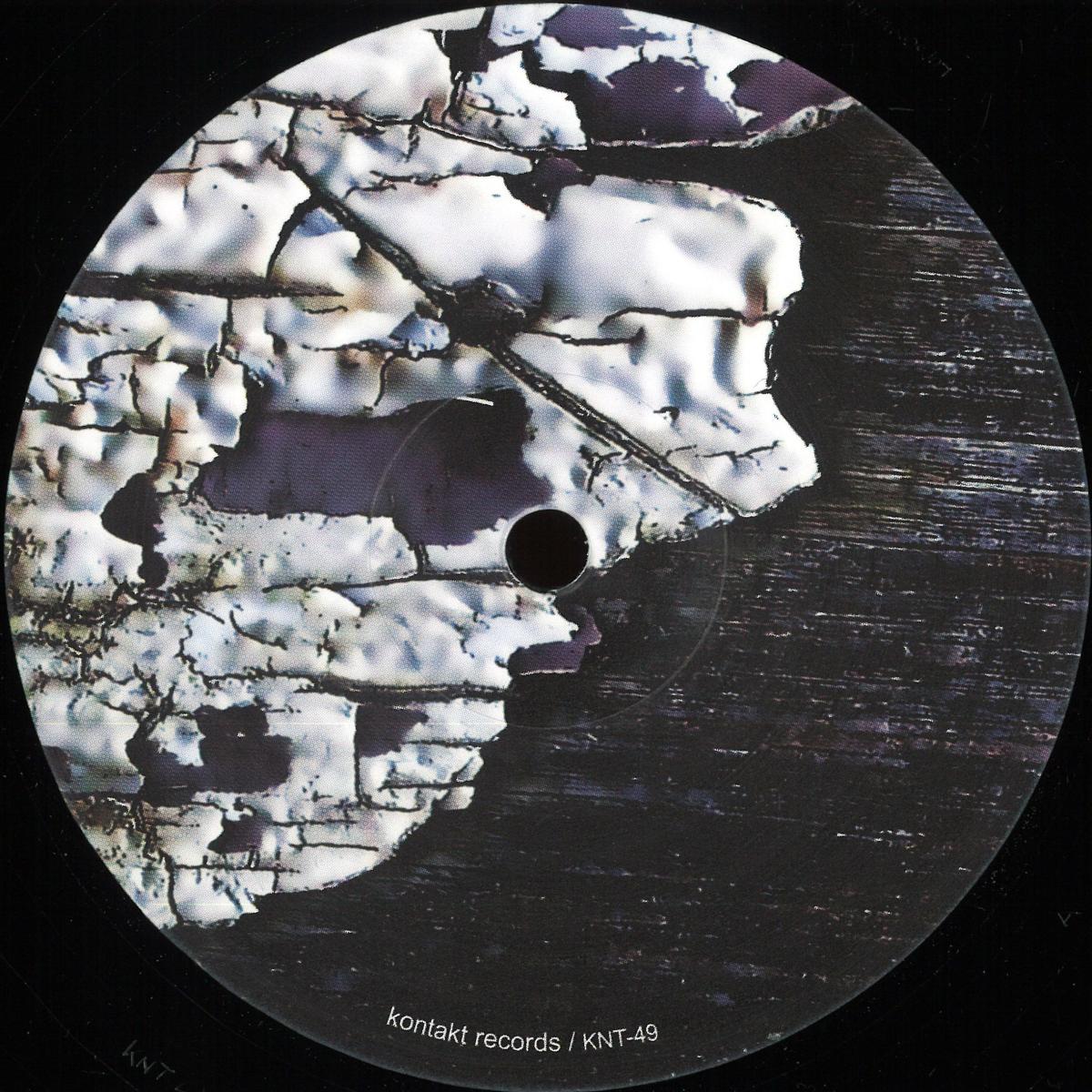 Decks Bluetrain Rolling Riddim vinyl record with colorful label artwork and black vinyl visible in a close-up shot.