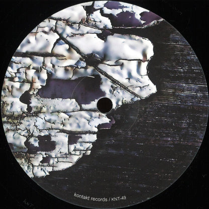 Decks Bluetrain Rolling Riddim vinyl record with colorful label artwork and black vinyl visible in a close-up shot.