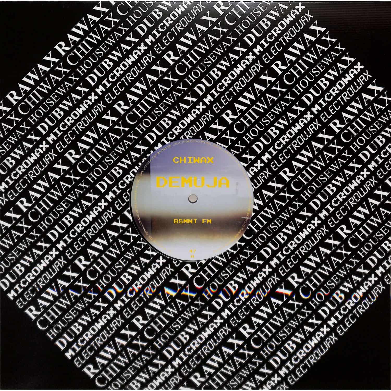 DBH DEMUJA BSMNT FM vinyl record with colorful abstract album cover artwork.