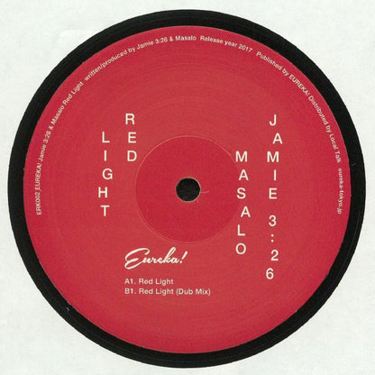 Second Hand vinyl record of JAMIE 3:26 by MASALO in red light, showing the album cover with vibrant red artwork.