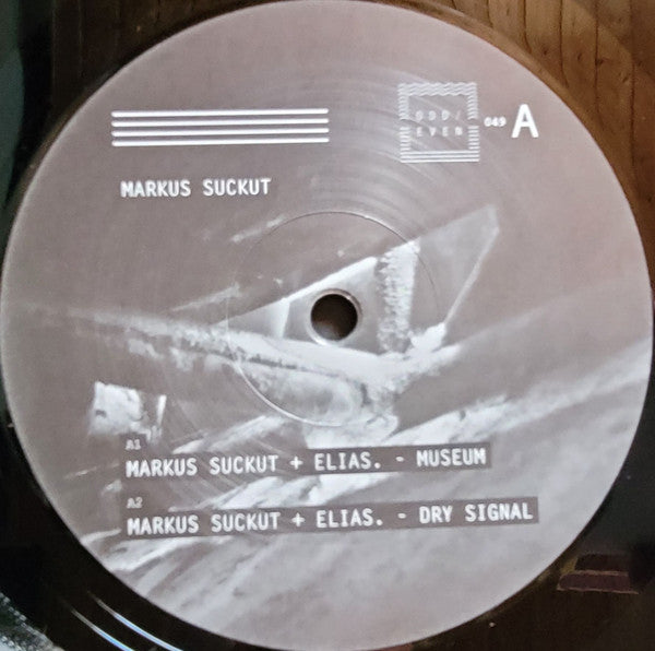 Decks Markus Suckut Museum Part II vinyl record with black and white cover art, featuring abstract geometric designs.