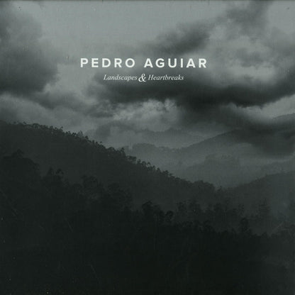 Second Hand vinyl record of Pedro Aguiar's "Landscapes & Heartbreaks" featuring album cover art with colorful landscape and heart imagery.