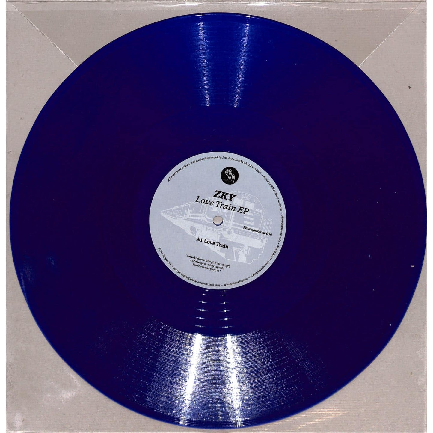 Syncrophone vinyl record ZKY LOVE TRAIN EP with colorful album cover art, featuring bold typography and vibrant design.