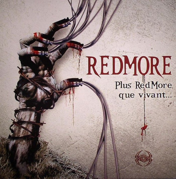 Redmore vinyl record titled "Plus Redmore Que Vivant" with colorful album art on the front, second-hand condition.