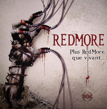 Redmore vinyl record titled "Plus Redmore Que Vivant" with colorful album art on the front, second-hand condition.