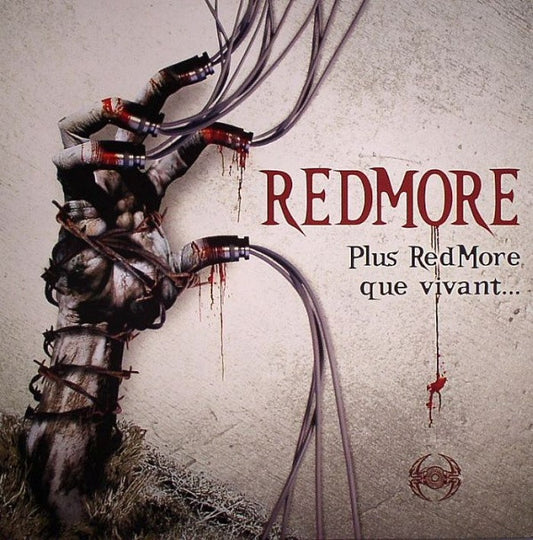 Redmore vinyl record titled "Plus Redmore Que Vivant" with colorful album art on the front, second-hand condition.