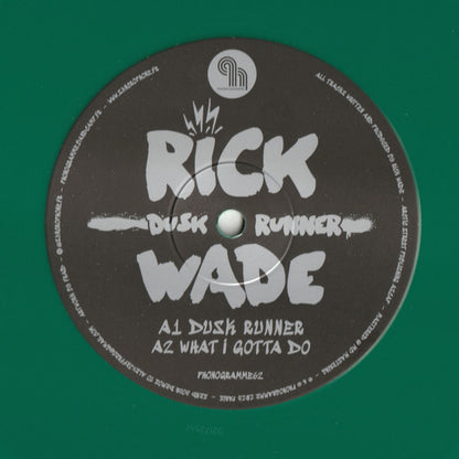 Vinyl record of Rick Wade’s Dusk Runner by Syncrophone, showing colorful abstract album artwork on the front cover.