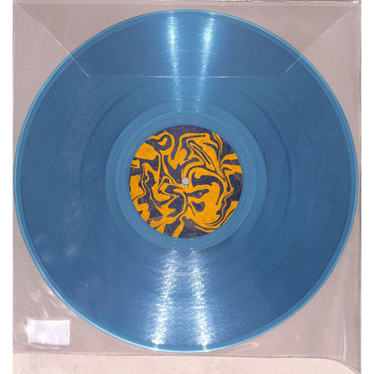Vinyl record titled SATOSHI TOMIIE – TRI-DUB by Syncrophone, showing the front cover with abstract artwork and album details.